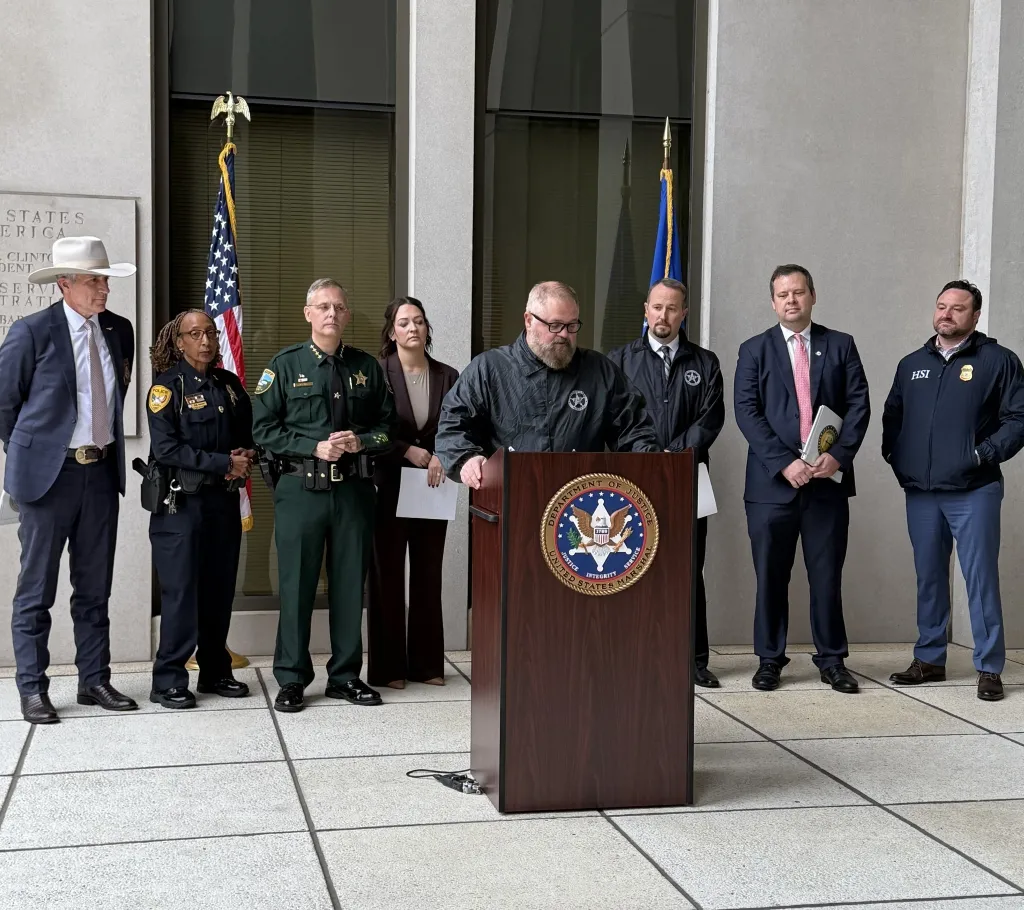 Law enforcement officials at a press conference announcing Operation 