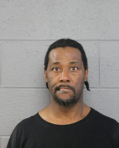 Mugshot of Lawrence Reed, a 50-year-old Chicago man, facing the camera with a neutral expression.