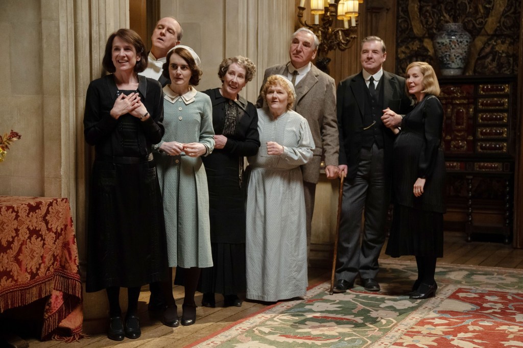 Raquel Cassidy, Kevin Doyle, Sophie McShera, Phyllis Logan, Lesley Nicol, Jim Carter, Brendan Coyle, and Joanne Froggatt in Downton Abbey: The Grand Finale.