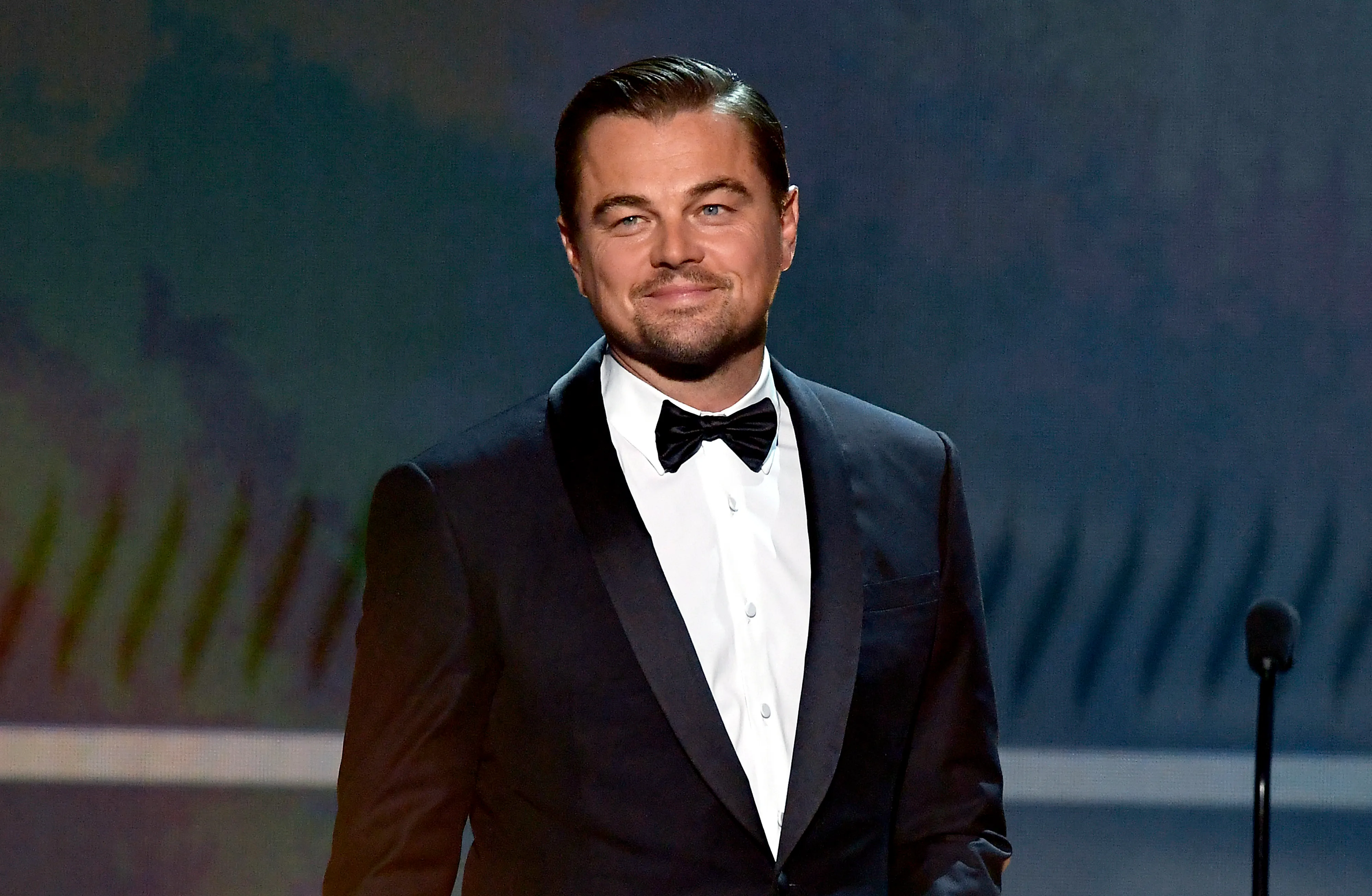 Leonardo DiCaprio smiling onstage at the 26th Annual Screen Actors Guild Awards.