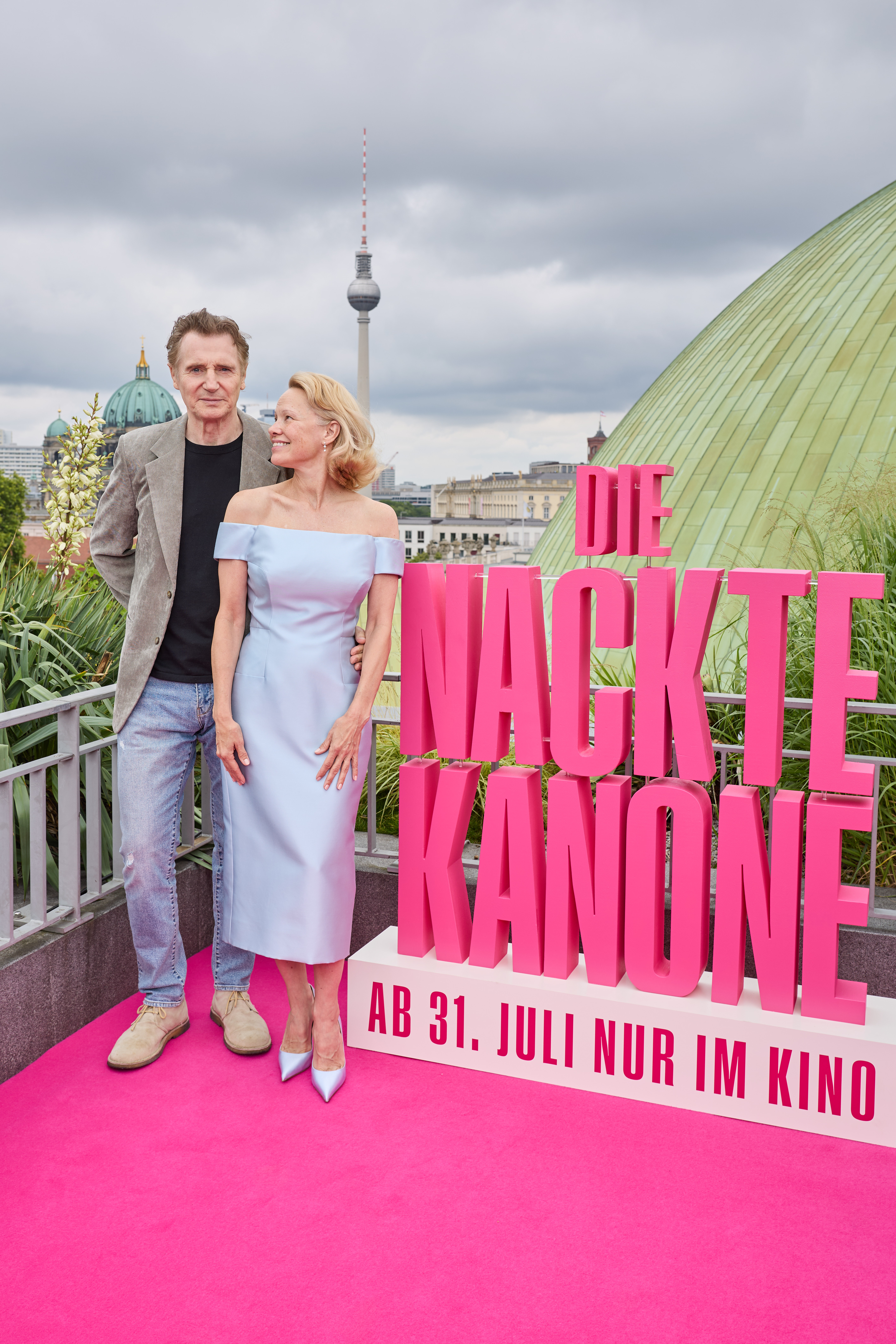 Liam Neeson and Pamela Anderson attending