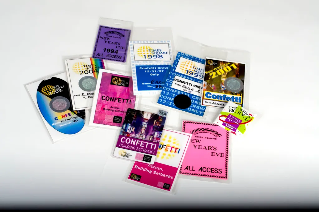 A collection of Times Square New Year's Eve access passes and confetti crew badges from 1994 to 2009.