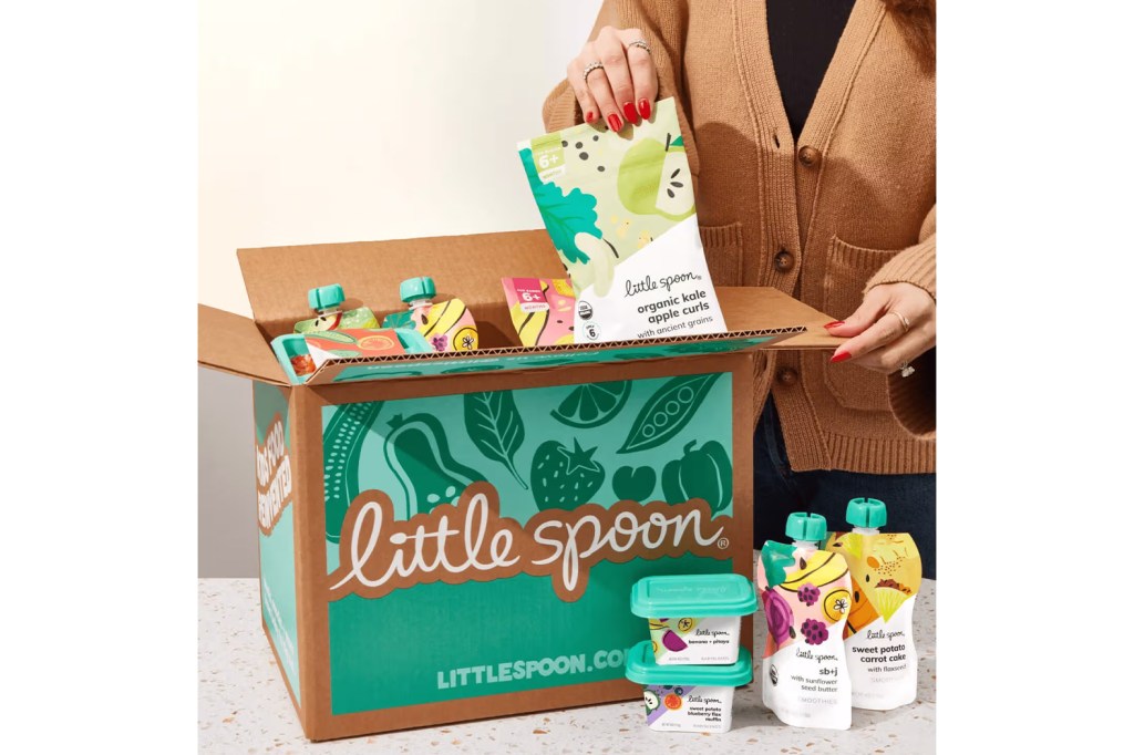 A woman holding a box of food