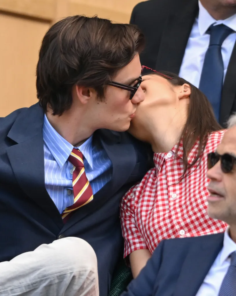Louis Partridge kisses Olivia Rodrigo on the cheek at Wimbledon.