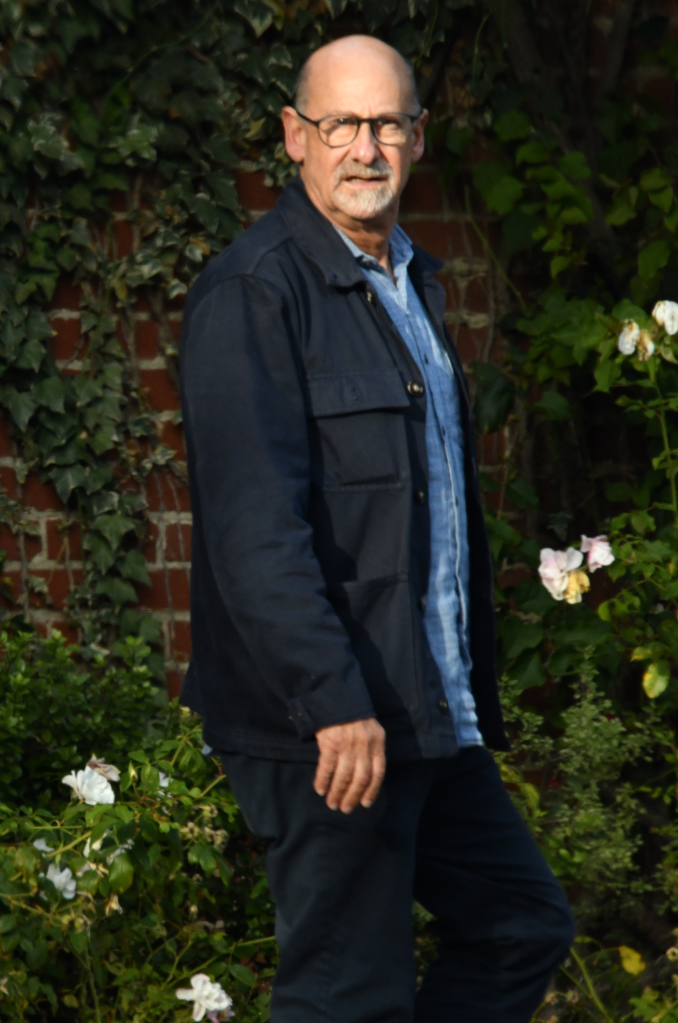 Lucas Reiner, Rob's brother, standing outdoors.