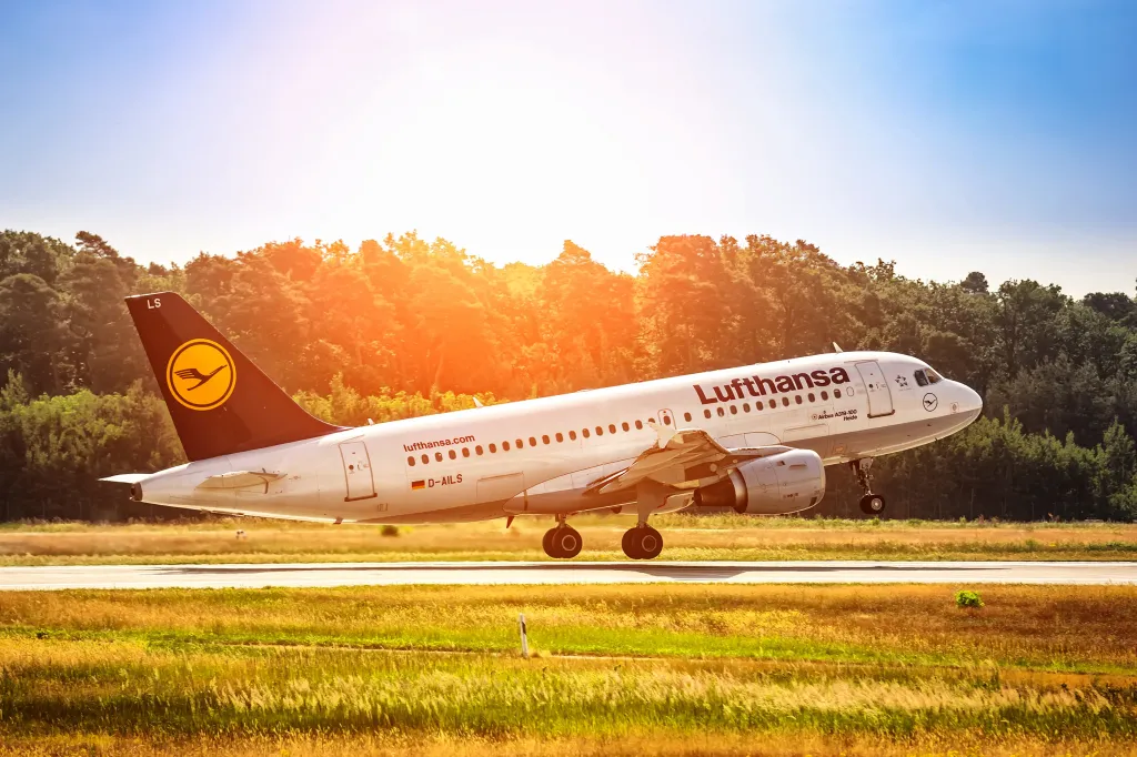 Airplane taking off during sunset