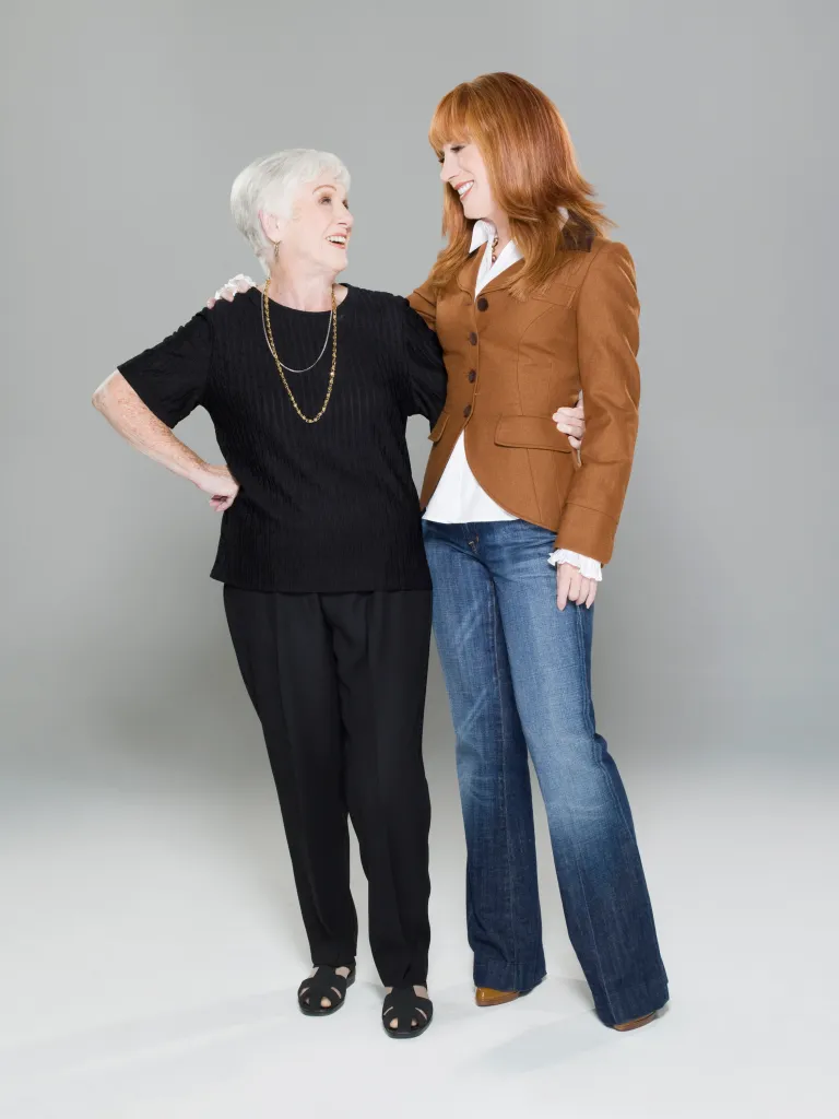 Maggie Griffin and Kathy Griffin smiling at each other.