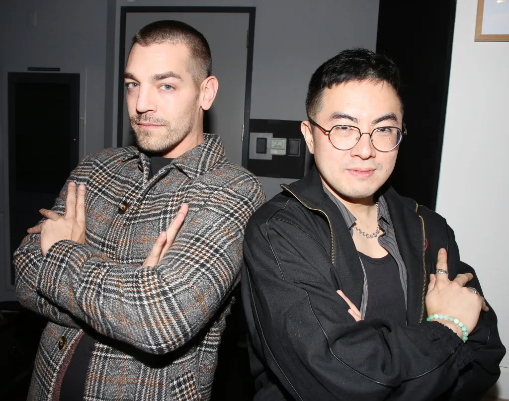 Matt Rogers and Bowen Yang pose backstage at 