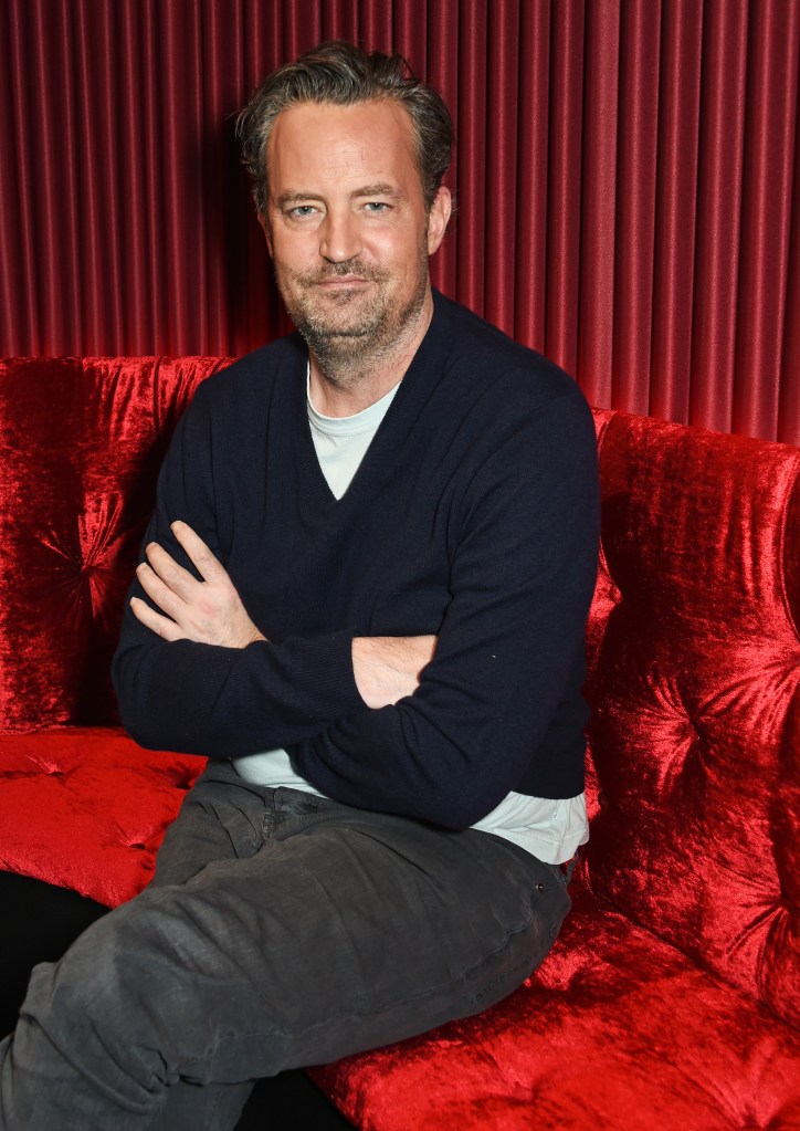 Matthew Perry posing for a photo at the photocall for