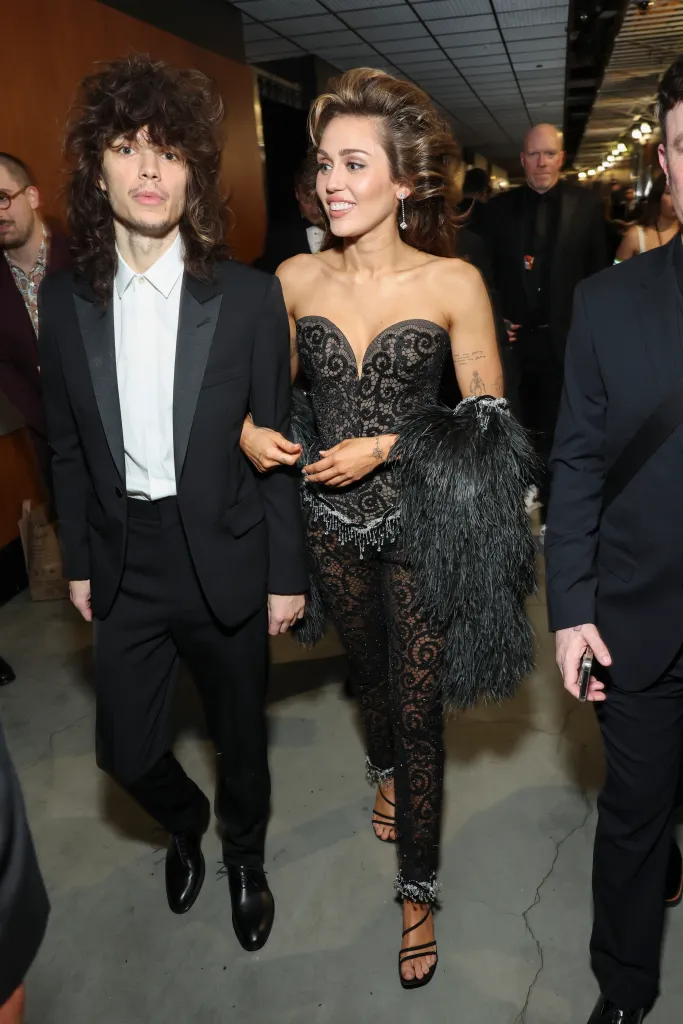 Maxx Morando and Miley Cyrus attending the 66th Annual Grammy Awards.