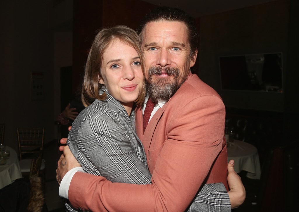 Maya Hawke and Ethan Hawke embracing.