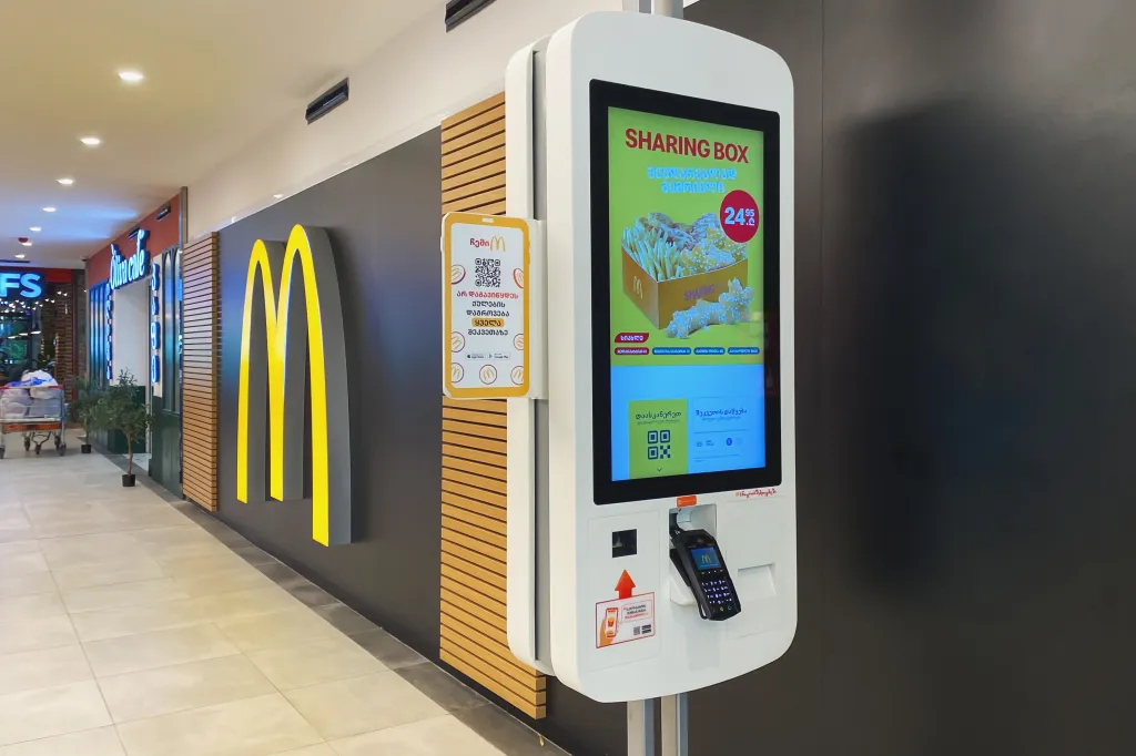 McDonald's restaurant in a shopping mall with self-service machines.
