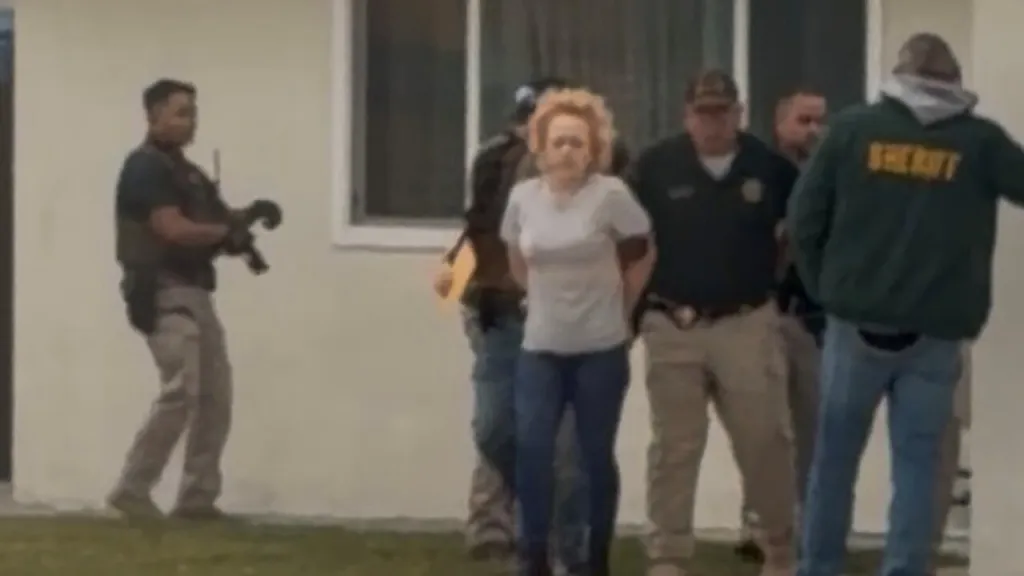 Ashlee Buzzard being taken into custody by multiple officers, with a 