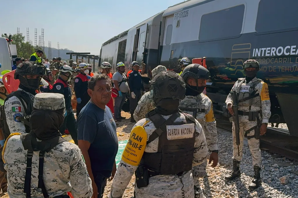 Mexican Army soldiers and Civil Protection members at the site of the Interoceanic train derailment in Asuncion Ixtaltepec, Oaxaca.
