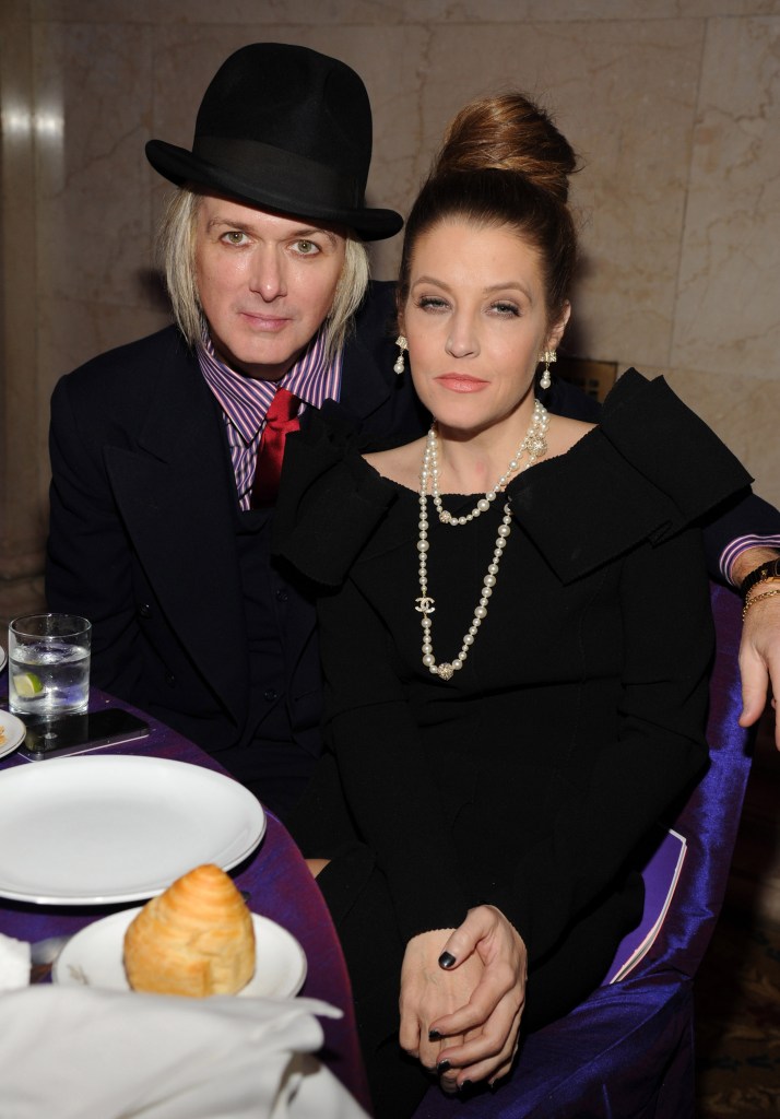 Michael Lockwood and Lisa Marie Presley sitting at a table.
