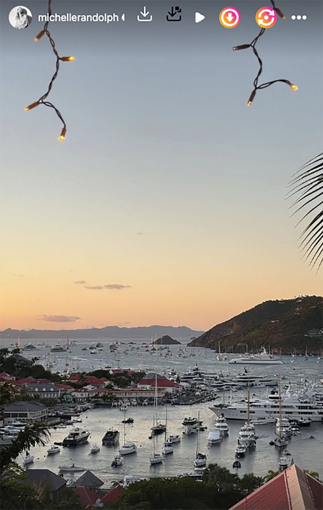 Michelle Randolph’s Instagram story of a harbor filled with boats and buildings at sunset.