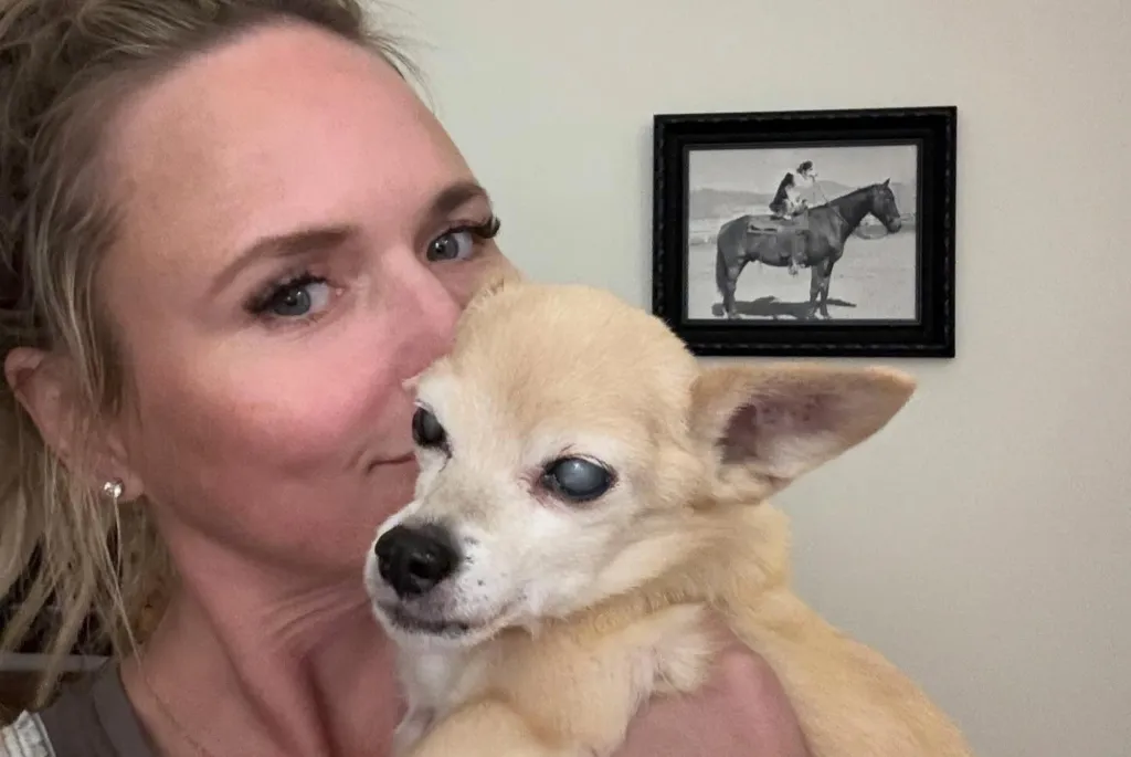 Miranda Lambert holding her beloved 15-year-old rescue dog.