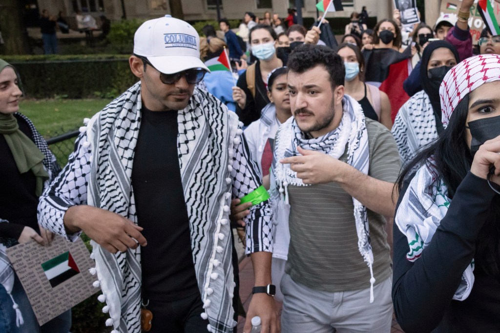 Mohsen Mahdawi, left, and Mahmoud Khalil participate in a pro-Palestinian protest at Columbia University.