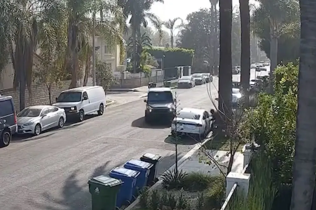 A gray car driven by a mother crashing into a black SUV, the thieves' getaway car, on a tree-lined residential street.