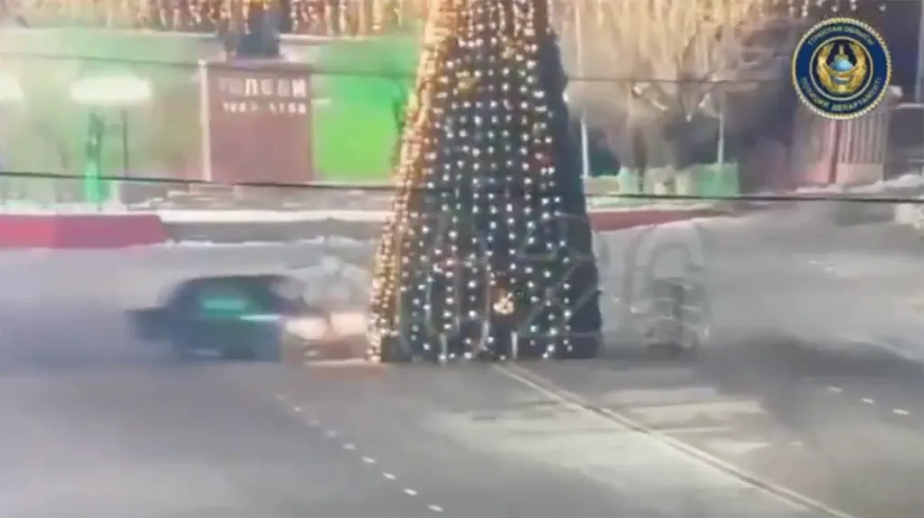 A car drifting and hitting a large Christmas tree, causing it to fall, in Saryagash, Kazakhstan.