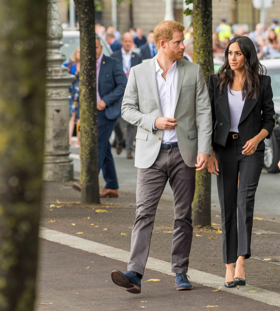 Prince Harry and Meghan Markle walking side-by-side.