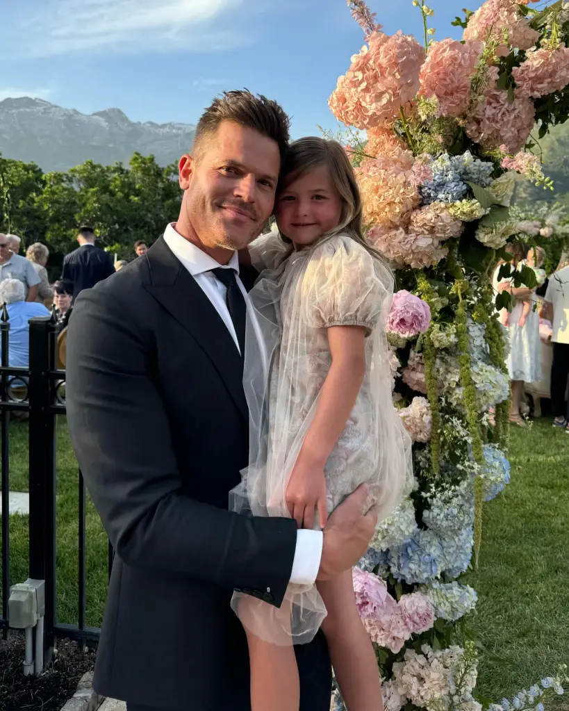 Bret Engemann holding his daughter.