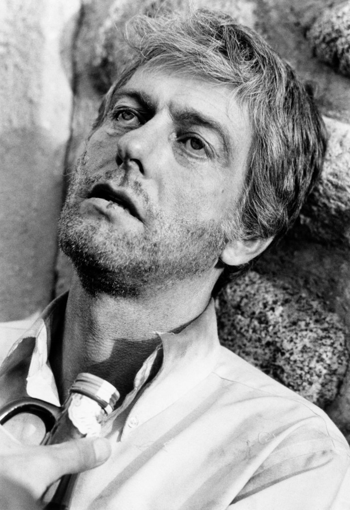 Dick Van Dyke as an unshaven alcoholic, holding a bottle, from 