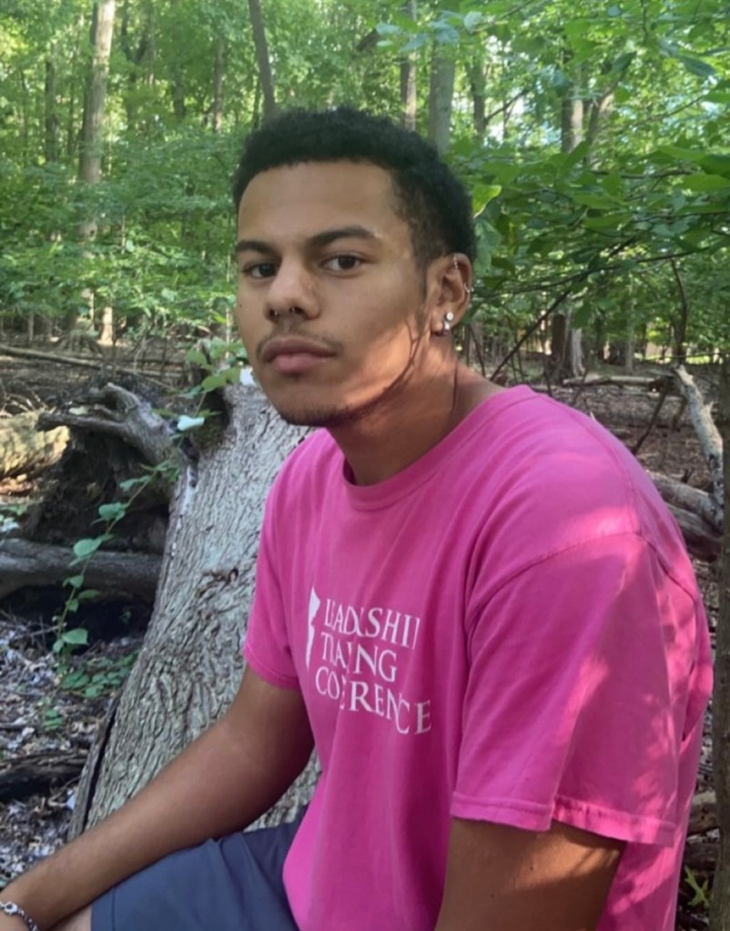 Morty Wortman in a pink t-shirt with