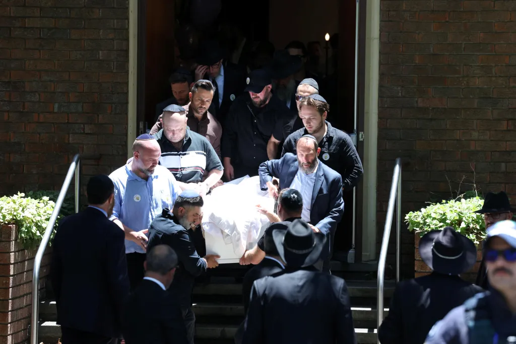 Mourners carry the casket of 10-year-old Matilda the youngest victim of a mass shooting at Australia's Bondi Beach targeting an event for the Jewish festival of Hanukkah on Sunday