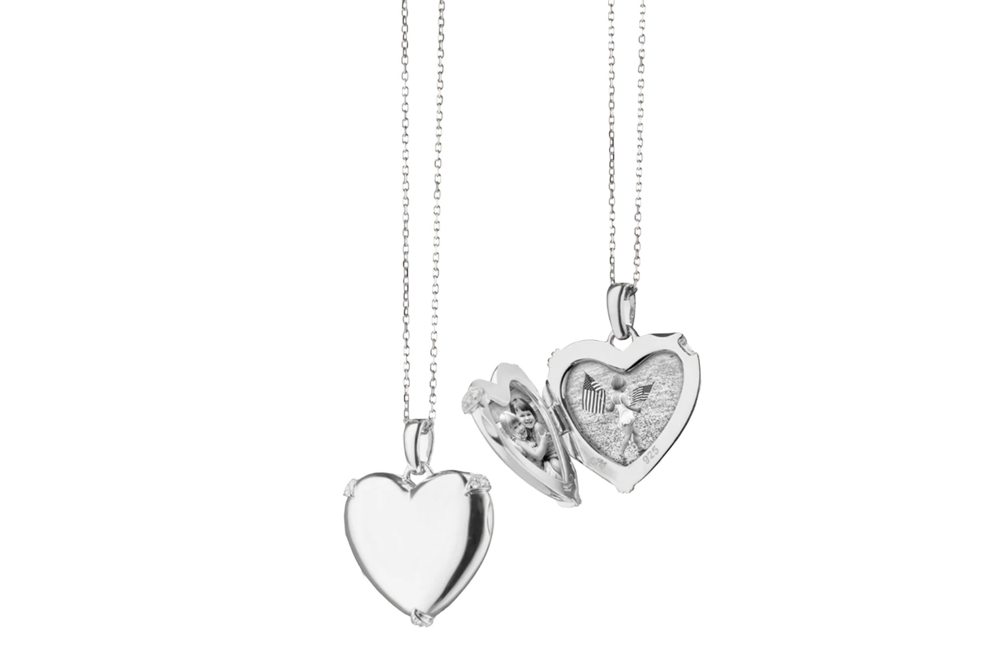 Two silver heart-shaped lockets on chains, one closed and one open revealing photos of children.