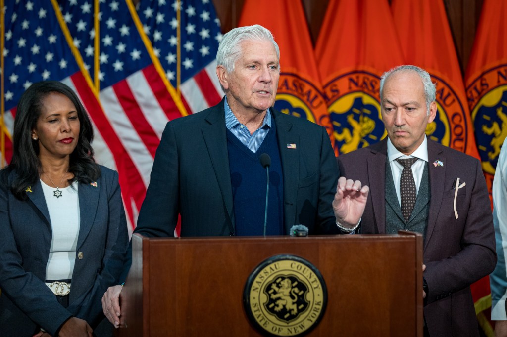 Nassau County Executive Bruce Blakeman and Legislator Mazi Pilip with a business leader.