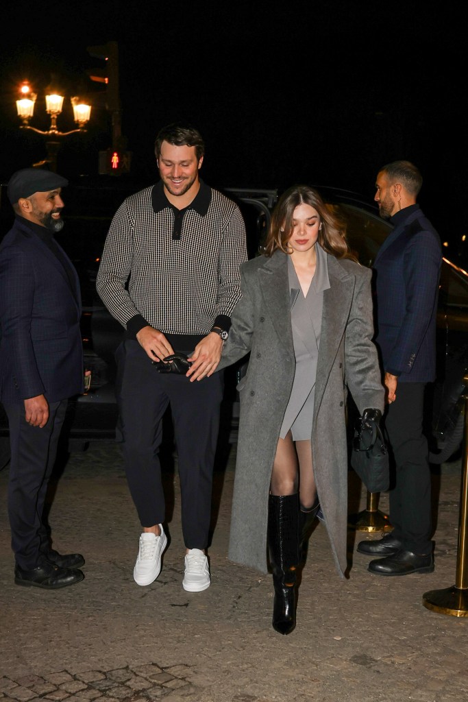 Hailee Steinfeld and Josh Allen hand in hand, leaving the Crillon restaurant.