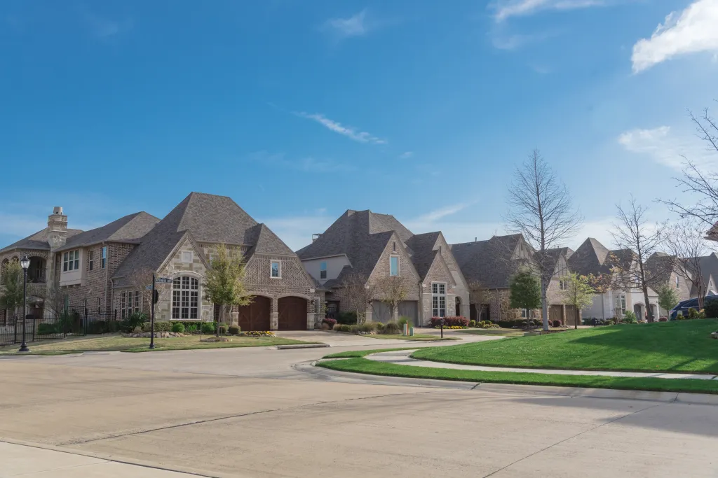 Row of brand new two-story houses in upscale residential neighborhood in suburbs of Dallas, Texas.