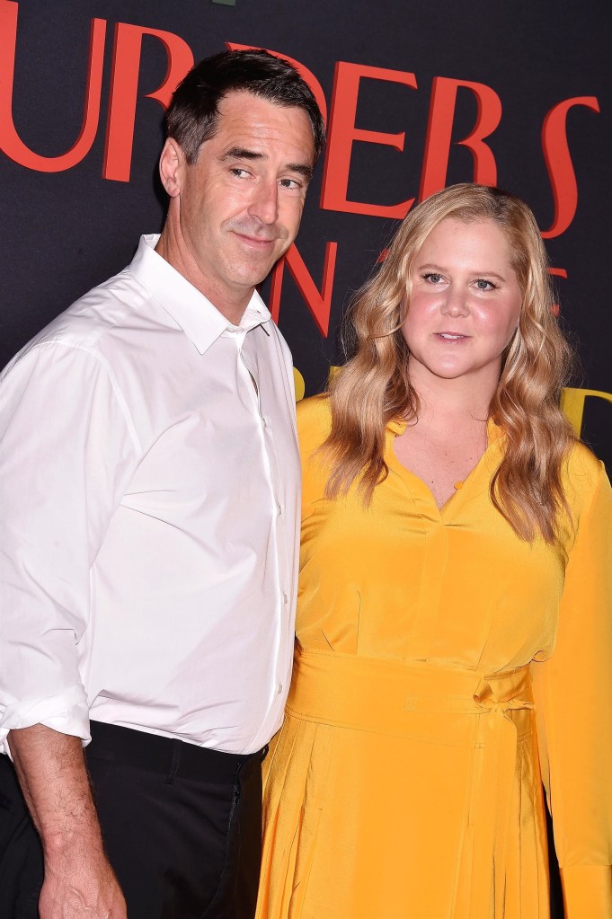Amy Schumer and Chris Fischer at an event.