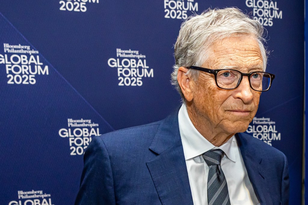 Bill Gates in a navy suit at the Bloomberg Philanthropies Global Forum 2025 event.