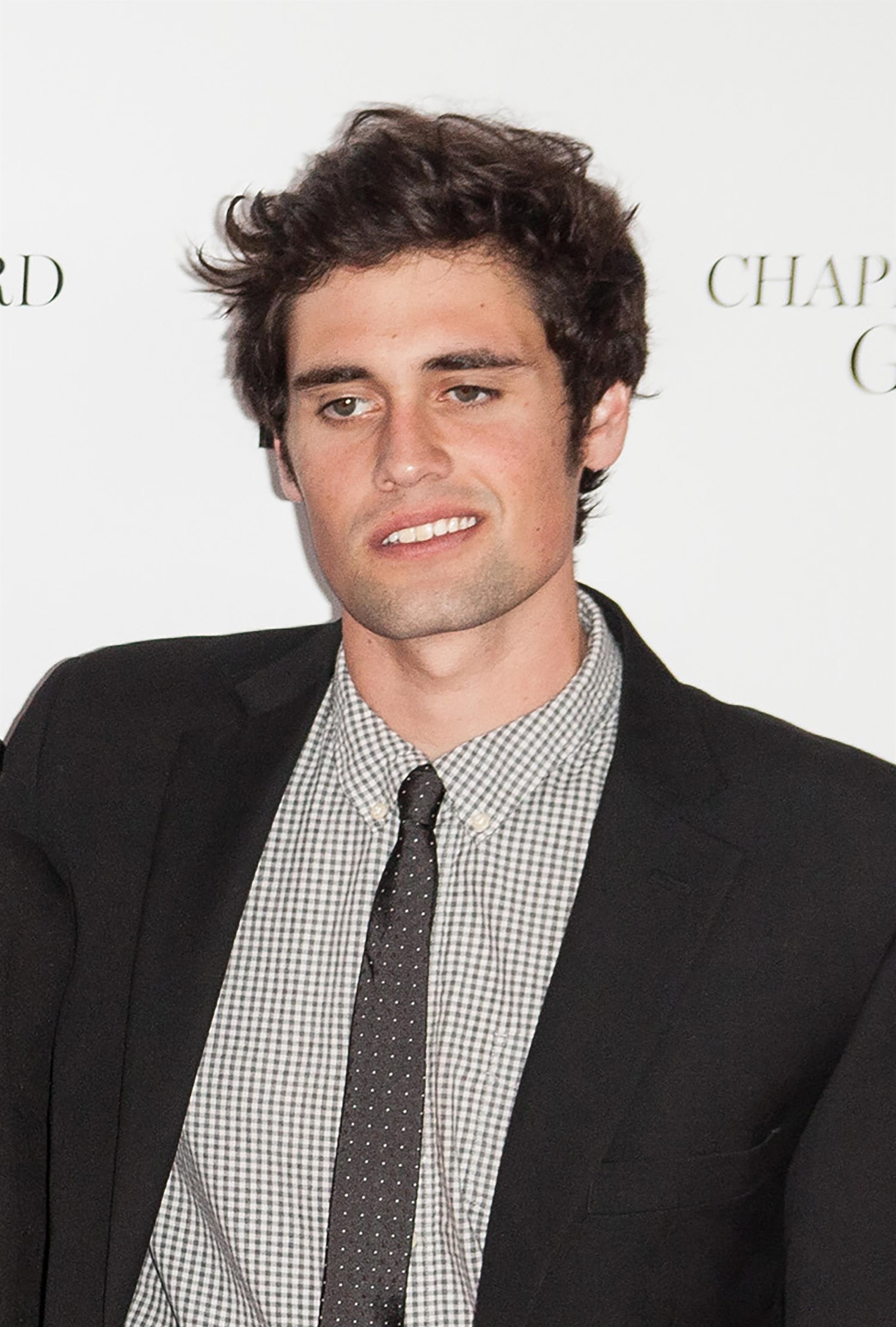 Nick Reiner in a suit and tie, looking slightly to the left.