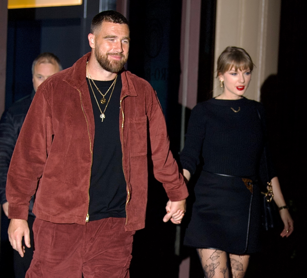 Taylor Swift and Travis Kelce holding hands while leaving Zero Bond in NYC.