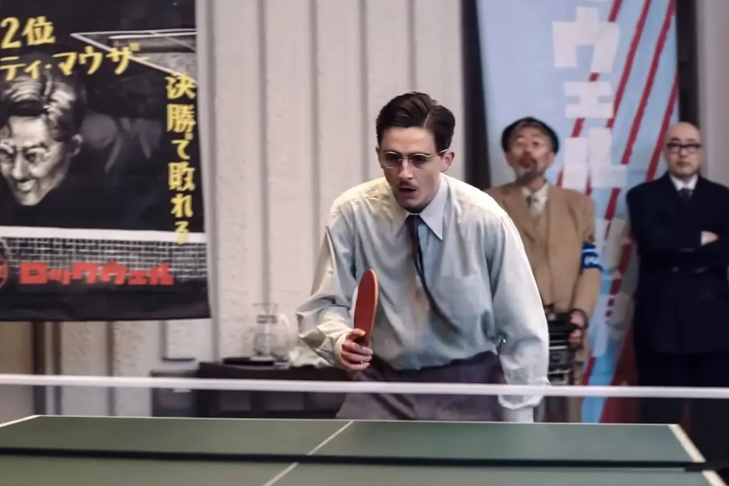 An image collage containing 1 images, Image 1 shows Timothée Chalamet as Marty Supreme playing ping-pong