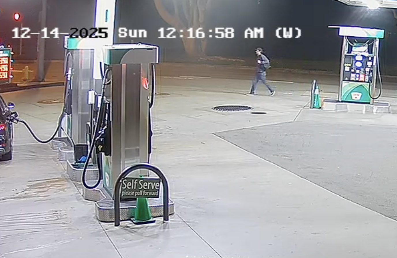 Nick Reiner walks by a gas station at night.