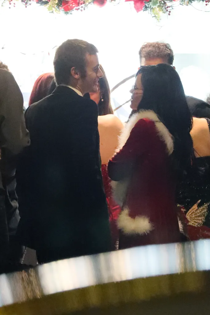 Lily Allen and Jonah Freud kissing at a Christmas party.