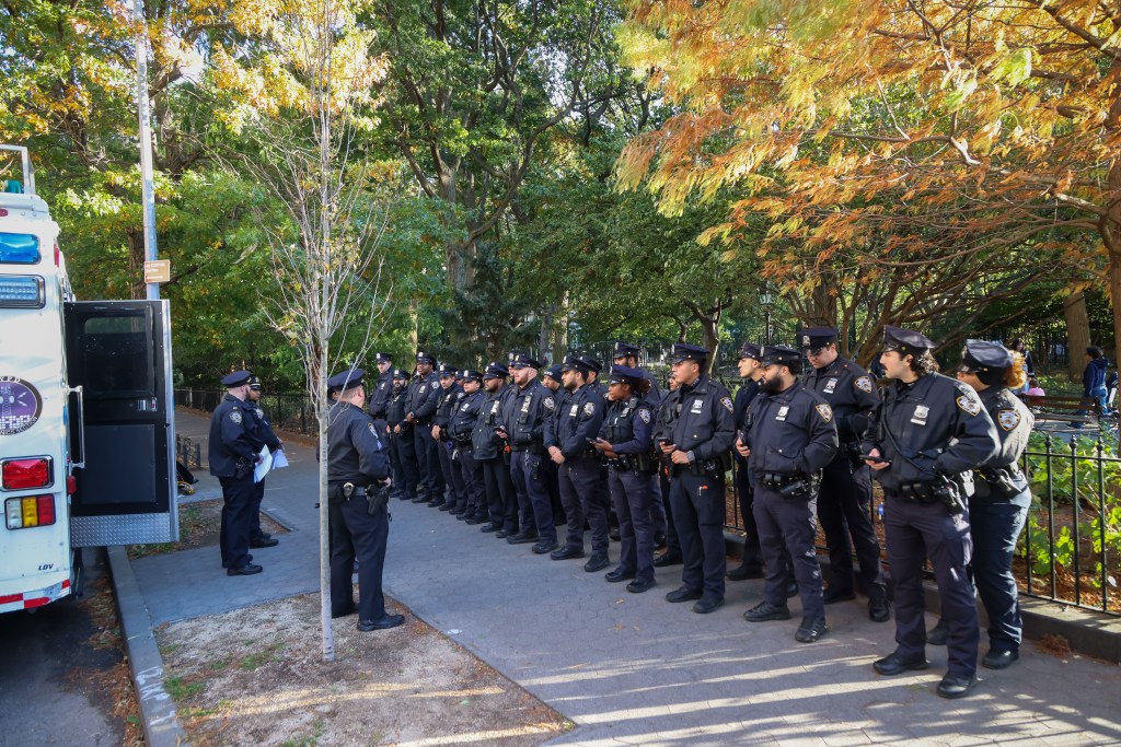 NYPD police officers during roll call in Washington Square Park.
