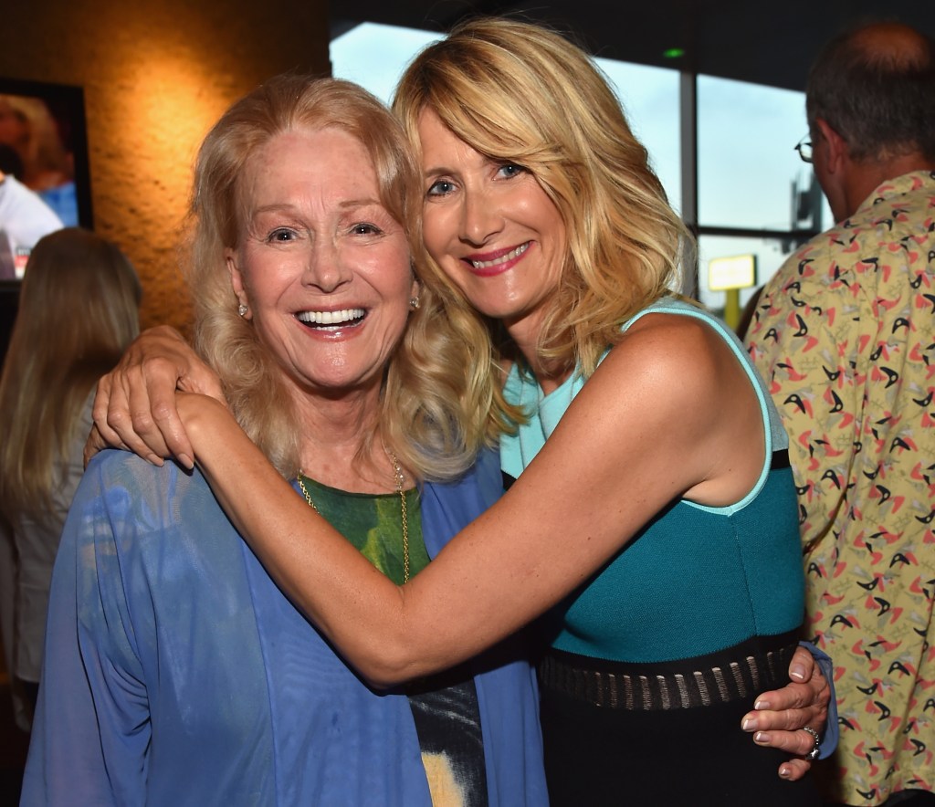 Actresses Diane Ladd and Laura Dern embracing at a film screening.