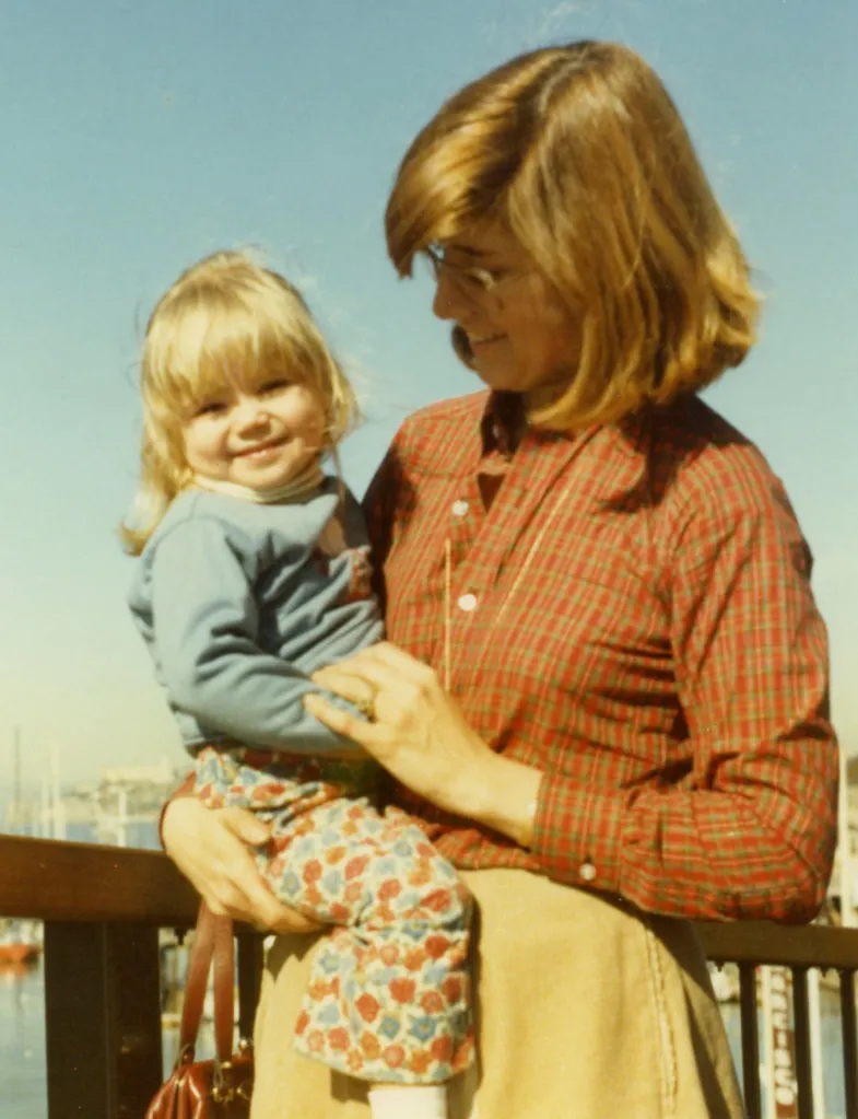 Nancy Galvani holding her young daughter.
