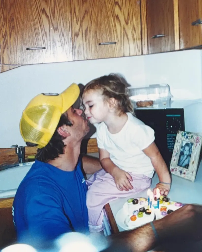 Paul Walker holds a birthday cake for his daughter Meadow.