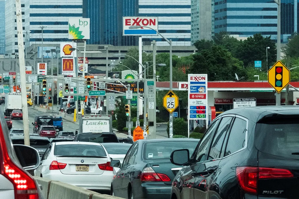 Cars are stuck in traffic near Exxon and BP gas stations at the exit of the Holland Tunnel in Newport, New Jersey.