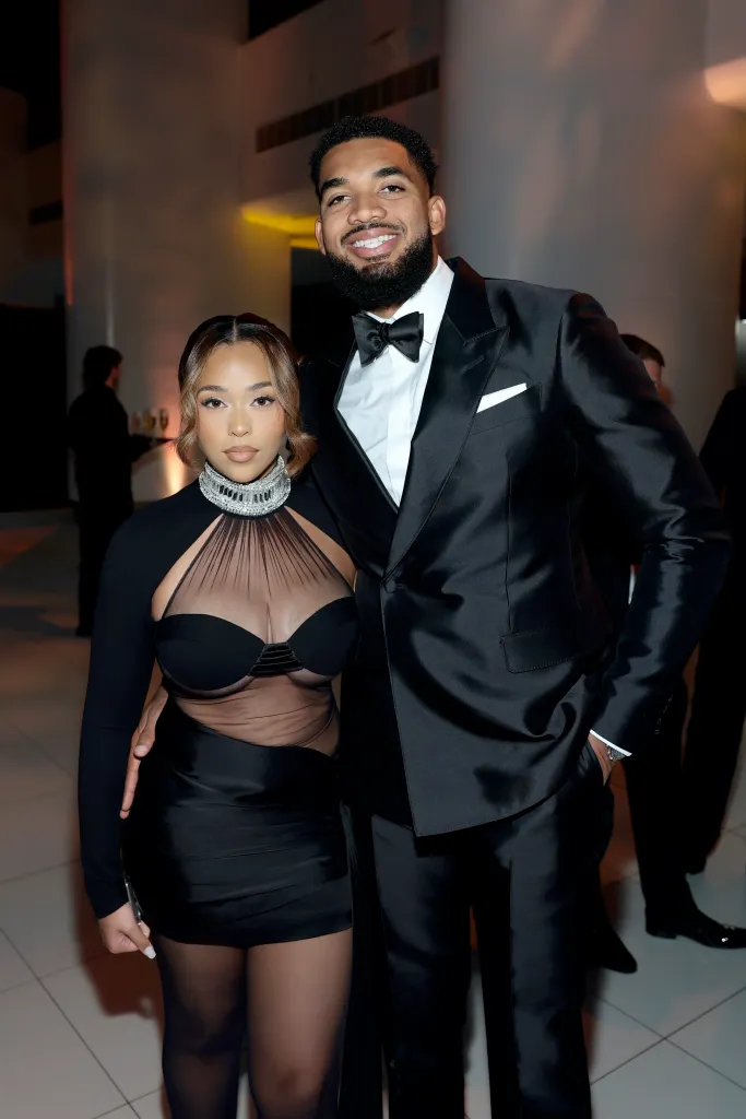 Jordyn Woods and Karl-Anthony Towns posing together at the REFORM Alliance Casino Night Event.