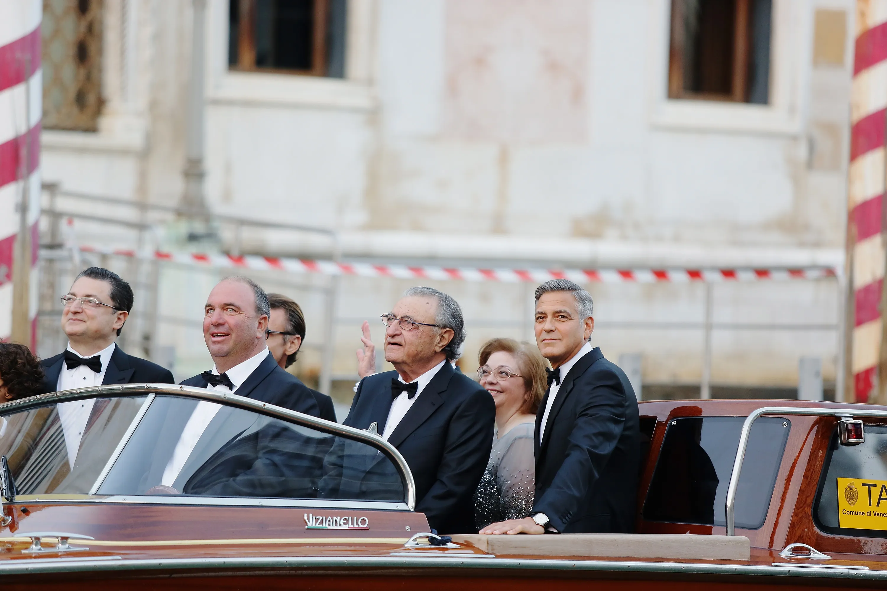 George Clooney in a tuxedo in a boat in Venice, Italy.
