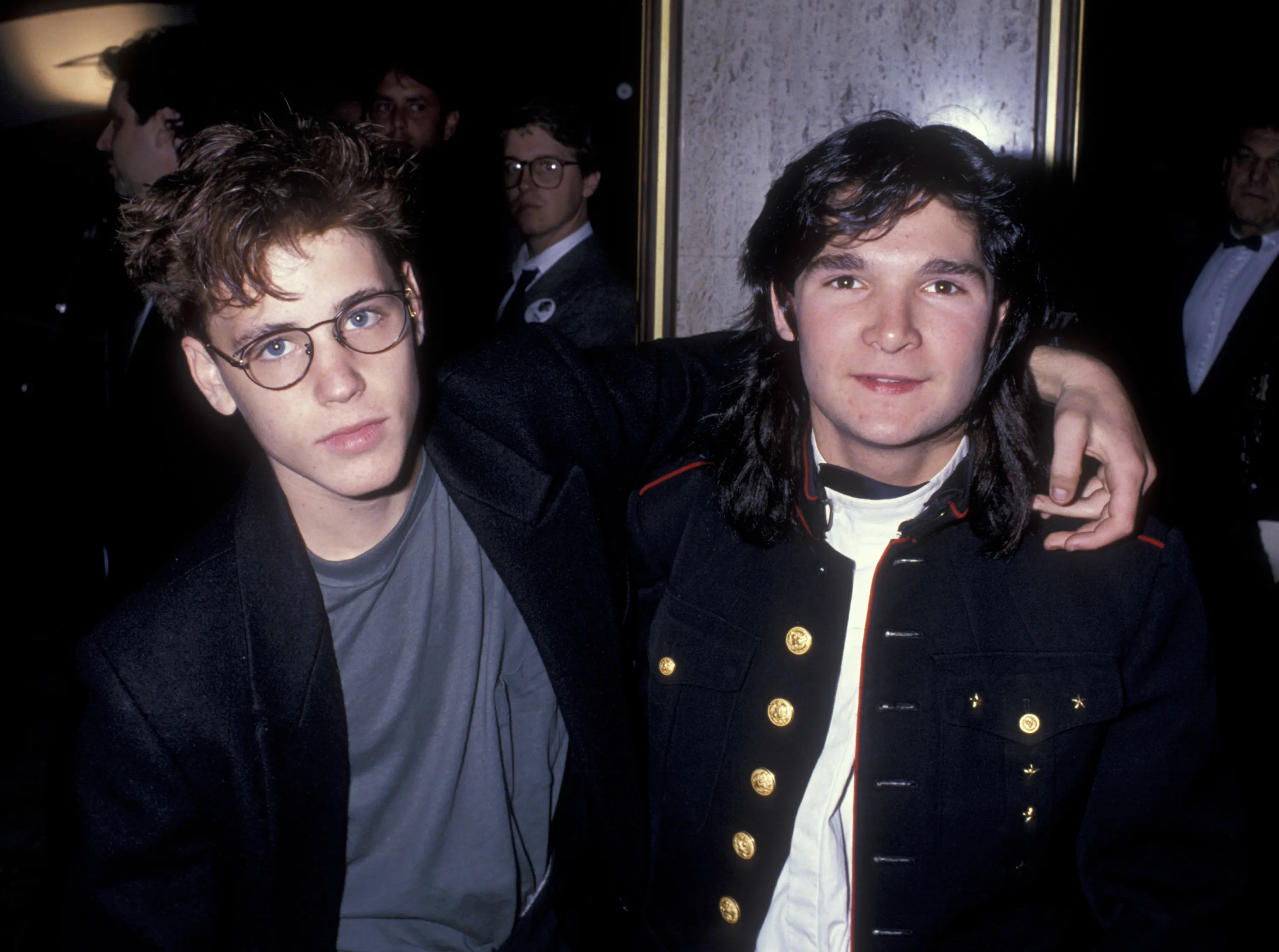 Actors Corey Haim and Corey Feldman posing for a picture at an awards event.