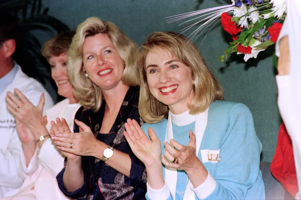 Tipper Gore and Hillary Clinton applauding at a campaign rally.