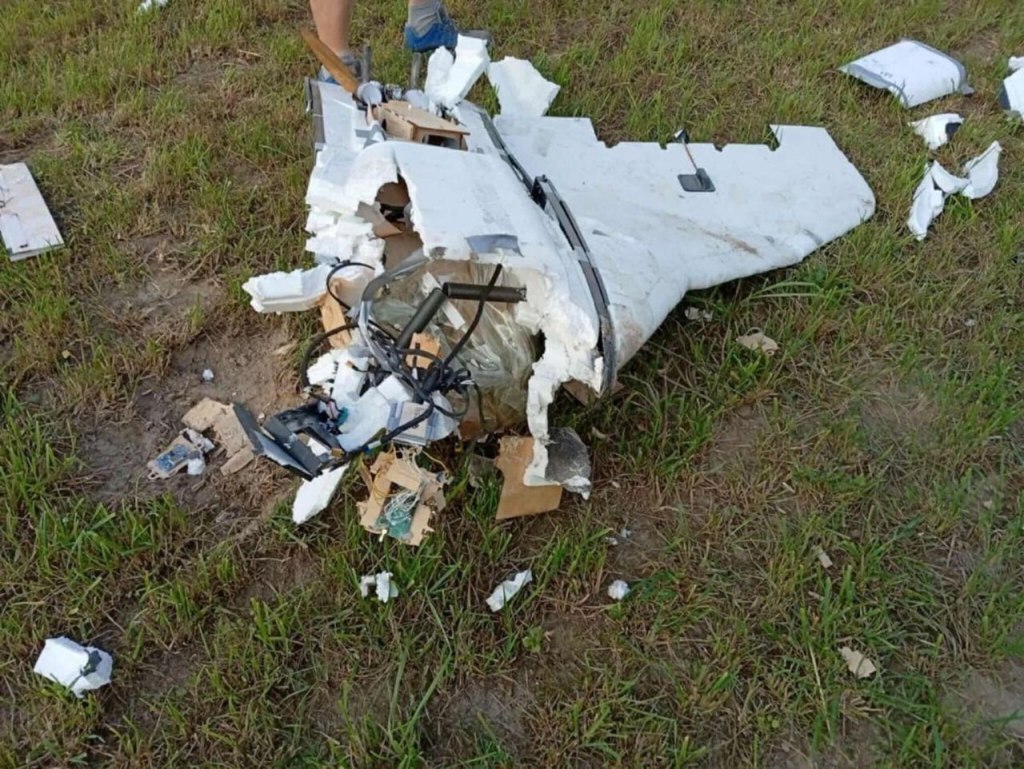 The wreckage of a drone that crashed on the ground.